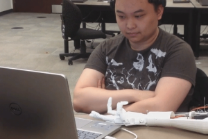 Controlling a Robotic Arm Using Facial Gestures [Video]