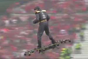 Man Flying On a Drone Delivering Ball for a Soccer Match