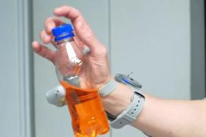 Robotic Extra Thumb Controlled with Toes