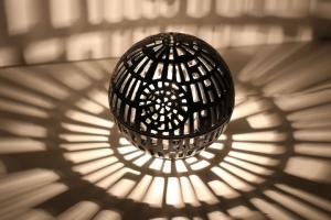 Reka Valkai’s Peace Star: Ceramic Handmade Death Star Lamp