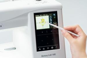 Janome Memory Craft 100E Embroidery Machine with Touchscreen Display